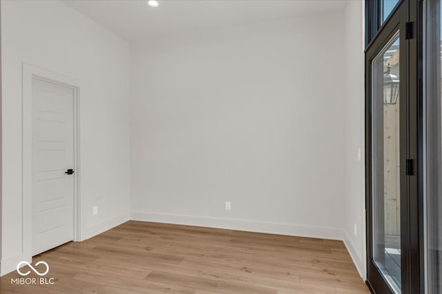 empty room with light hardwood / wood-style flooring