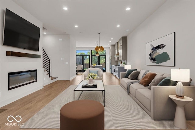 living room with light hardwood / wood-style floors