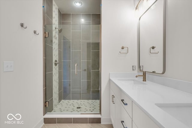 bathroom featuring vanity, an enclosed shower, and tile patterned flooring