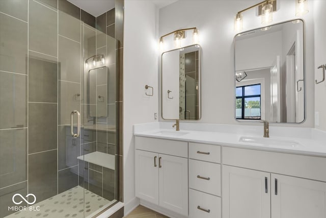 bathroom with an enclosed shower and vanity