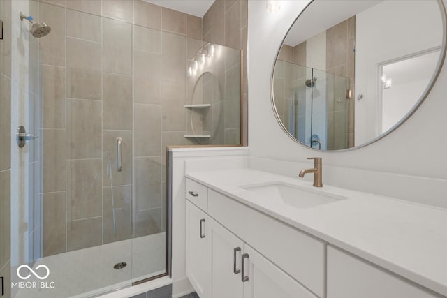 bathroom featuring walk in shower and vanity