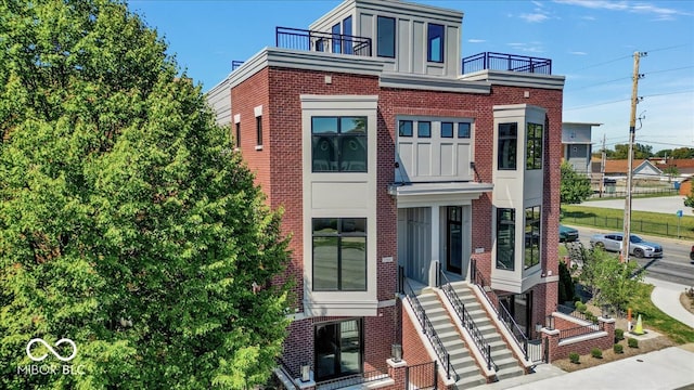 view of front of property with a balcony