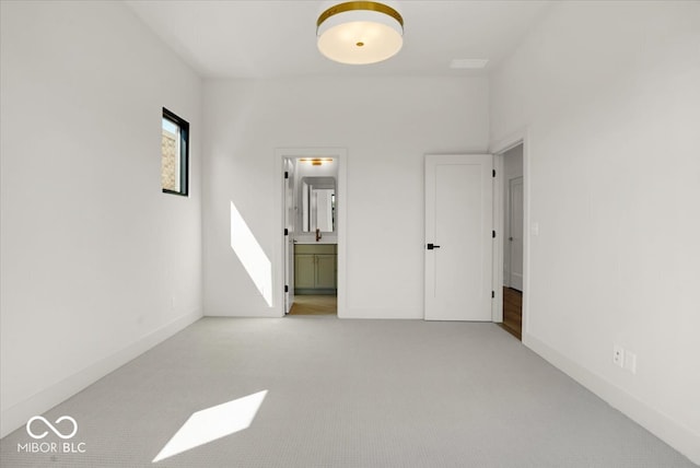 unfurnished room with light colored carpet