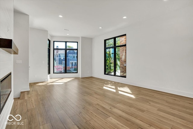 unfurnished living room with light hardwood / wood-style floors