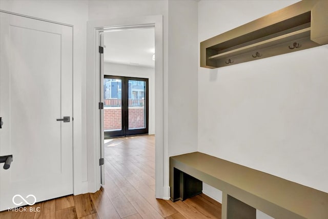 mudroom featuring light wood-type flooring and french doors