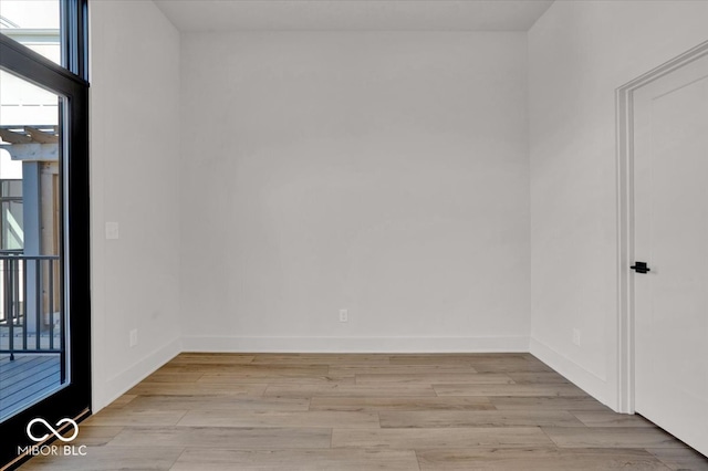 spare room with light hardwood / wood-style floors