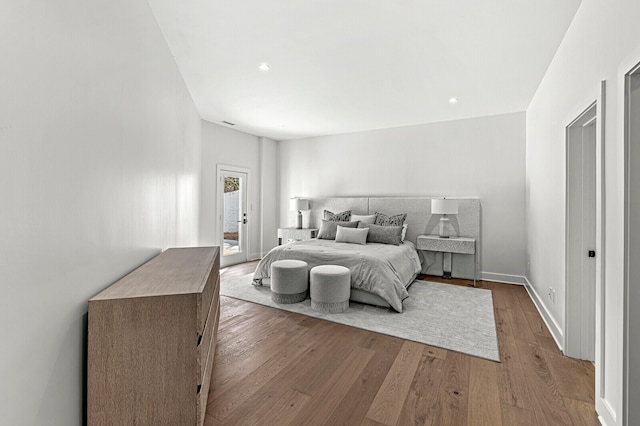 bedroom with hardwood / wood-style floors