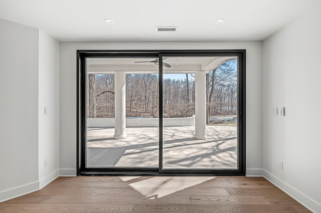 doorway with light hardwood / wood-style flooring