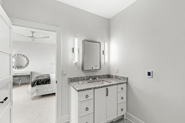 bathroom featuring ceiling fan and vanity