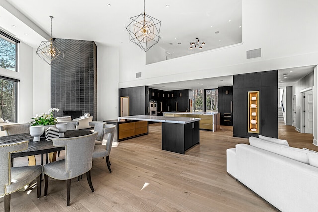 kitchen featuring hanging light fixtures, a high ceiling, and a kitchen island