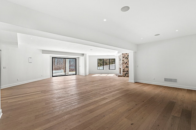 unfurnished living room featuring light wood-type flooring