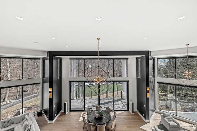 interior space with a chandelier and light wood-type flooring