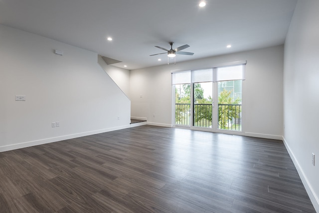 empty room featuring dark hardwood / wood-style floors and ceiling fan