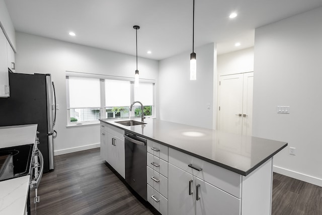 kitchen with hanging light fixtures, stainless steel appliances, white cabinetry, and dark wood-type flooring