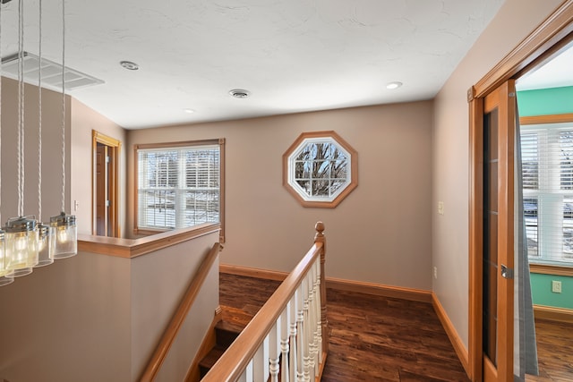 corridor featuring dark hardwood / wood-style flooring