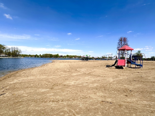 view of playground with a water view