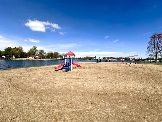 view of playground with a water view