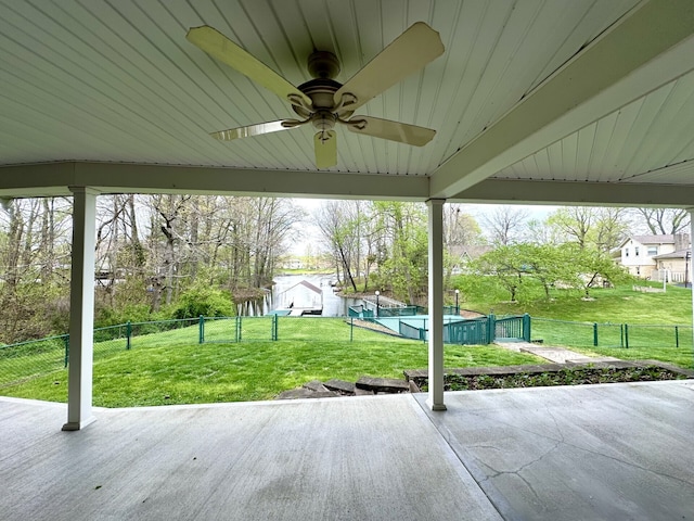 view of patio / terrace featuring a shed and ceiling fan