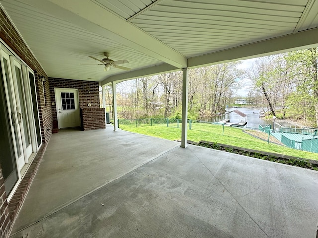 view of patio with a swimming pool and ceiling fan