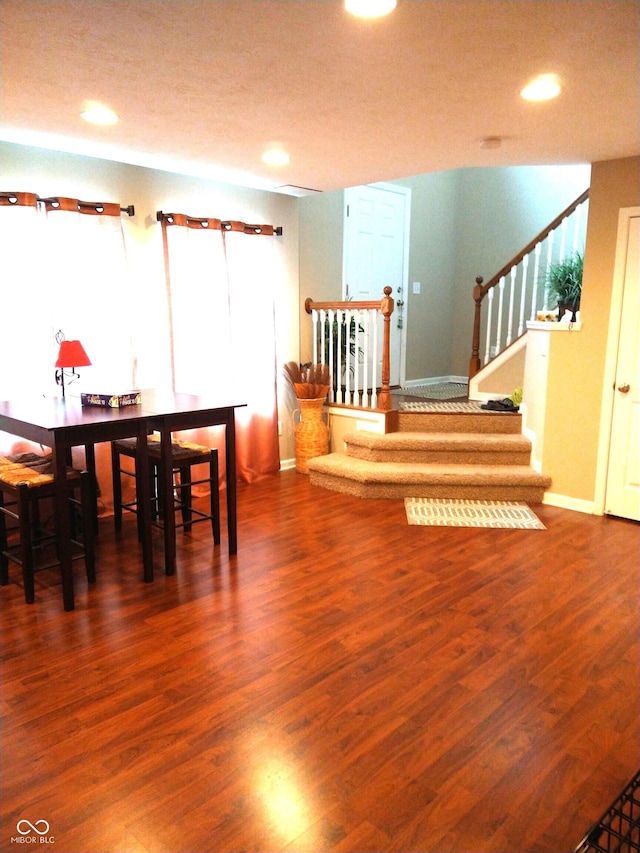 dining space with dark wood-type flooring