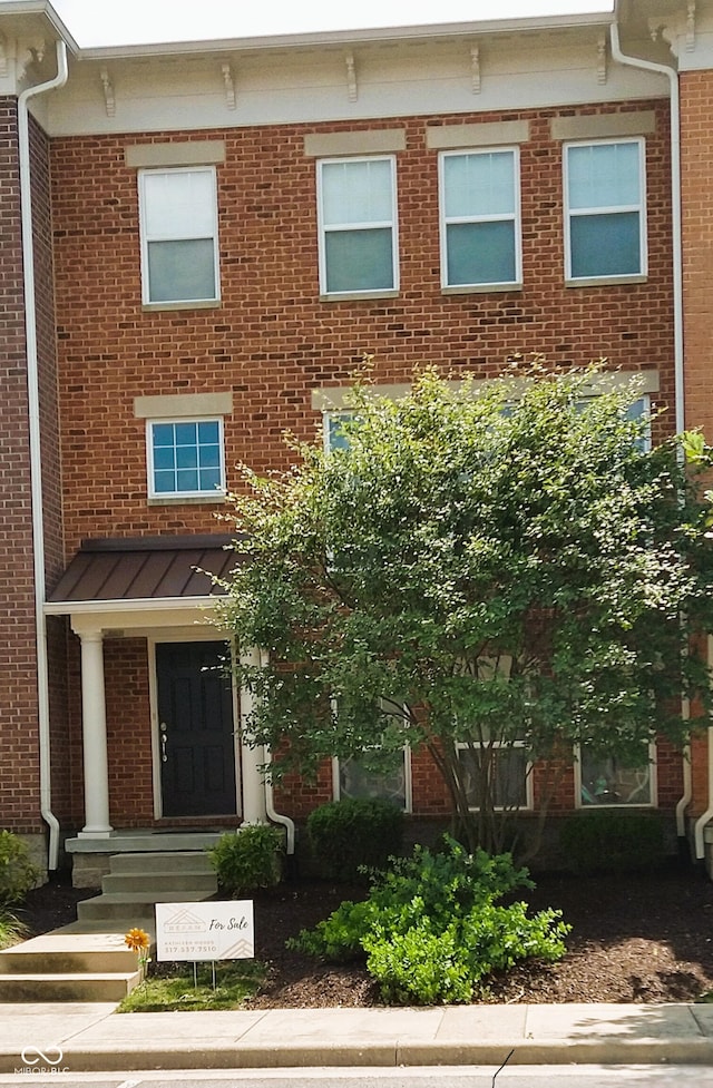 multi unit property featuring brick siding