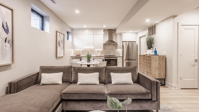 living room with light hardwood / wood-style floors