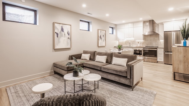 living room with light hardwood / wood-style floors