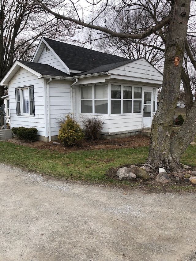 view of side of home featuring central air condition unit