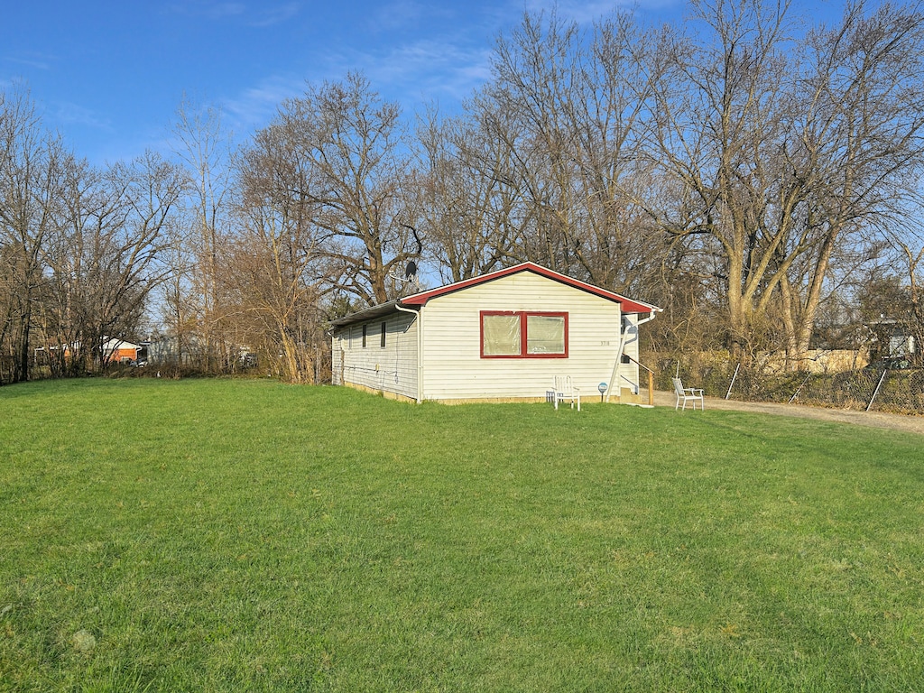 exterior space featuring a front lawn