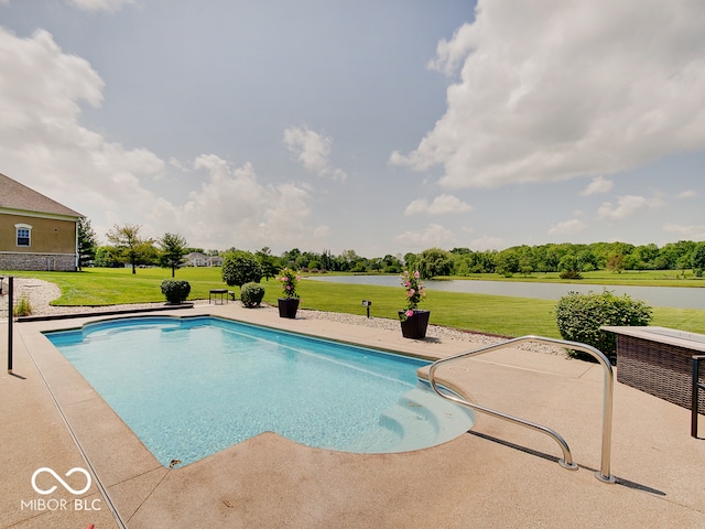 view of pool with a water view, a yard, and a patio