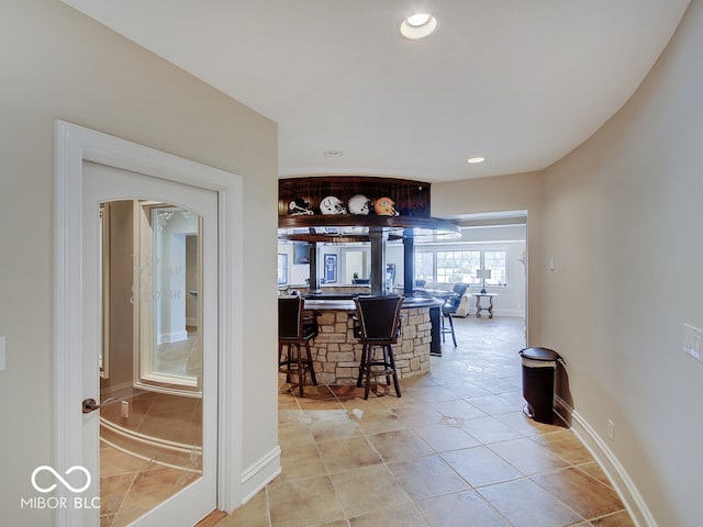 hallway with light tile patterned floors