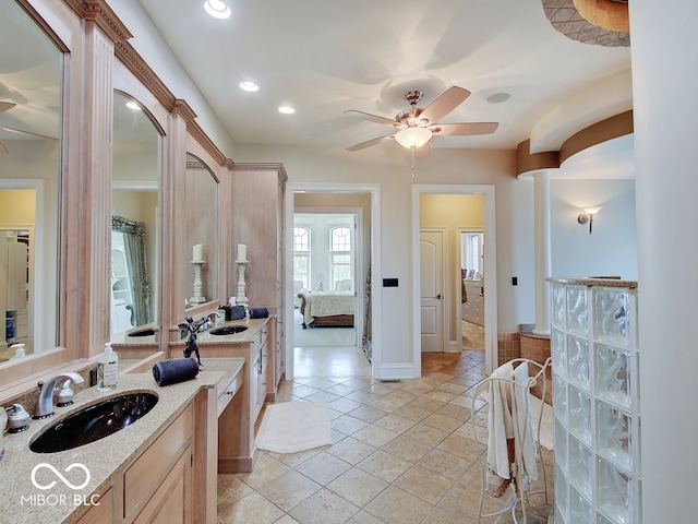 bathroom featuring ceiling fan and vanity