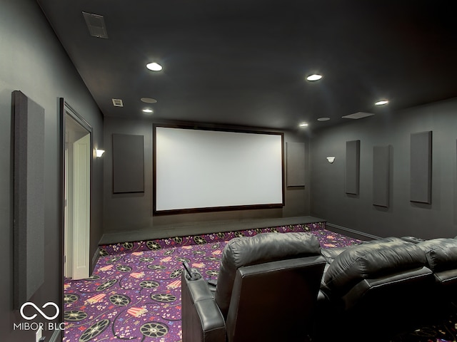 home theater room with light colored carpet