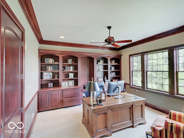 carpeted home office featuring ornamental molding and ceiling fan