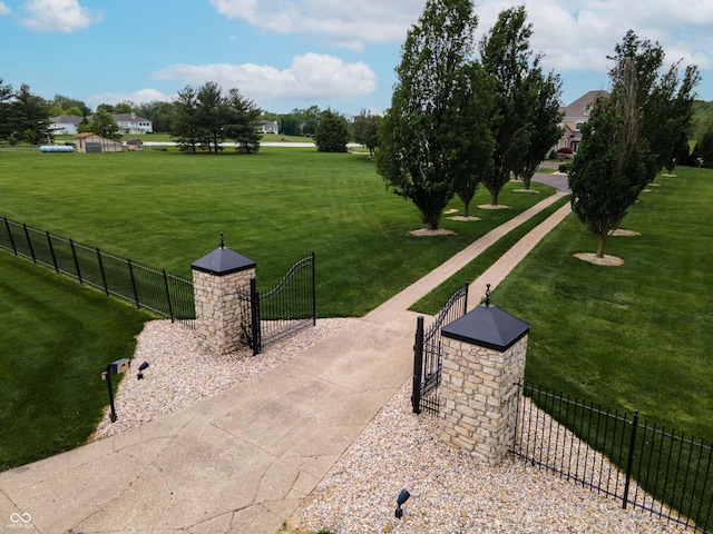 view of property's community featuring a yard