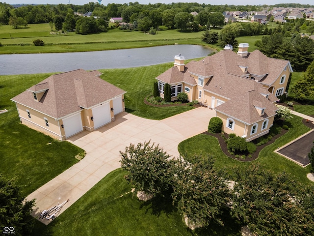 birds eye view of property featuring a water view