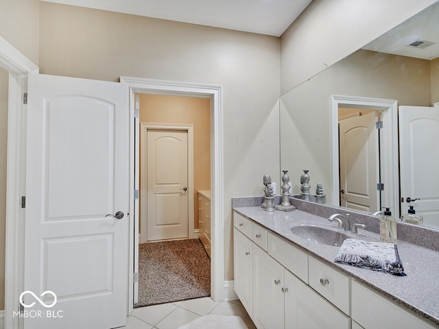 bathroom with vanity and tile patterned flooring