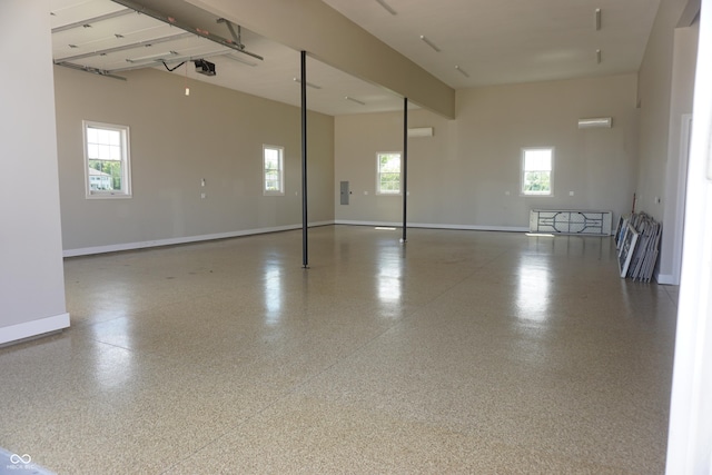 spare room featuring a towering ceiling