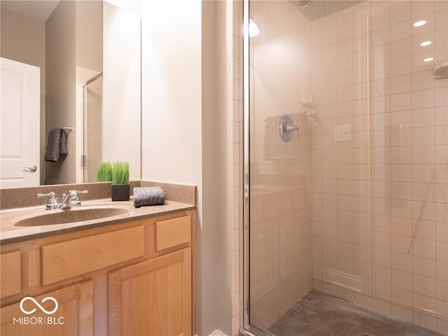 bathroom with a shower with door and oversized vanity