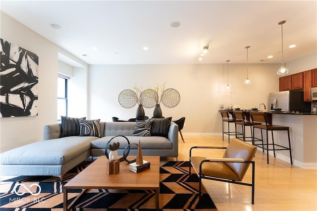 living room with light hardwood / wood-style floors