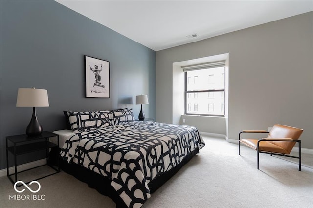 bedroom with light colored carpet