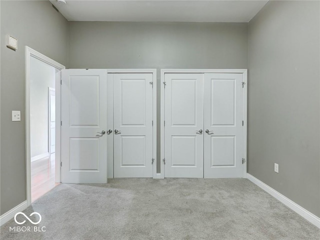 unfurnished bedroom with light carpet