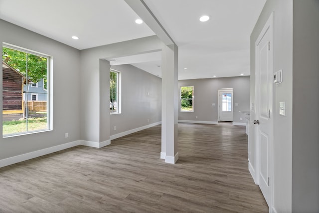 unfurnished room with dark hardwood / wood-style flooring