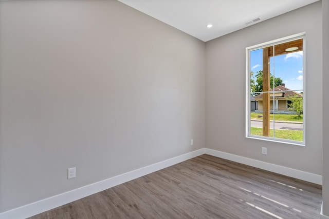 unfurnished room with light hardwood / wood-style flooring