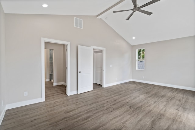 interior space with ceiling fan, dark hardwood / wood-style floors, beam ceiling, and high vaulted ceiling