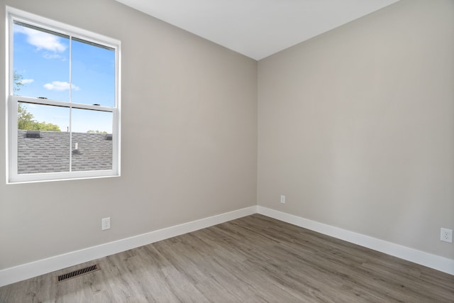 empty room featuring dark hardwood / wood-style flooring