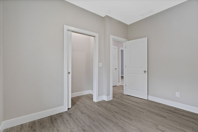 unfurnished bedroom with light hardwood / wood-style flooring