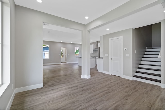 empty room with light hardwood / wood-style flooring