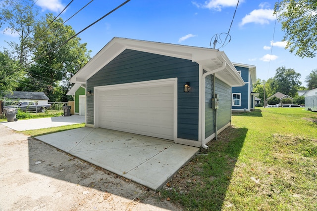 garage featuring a yard