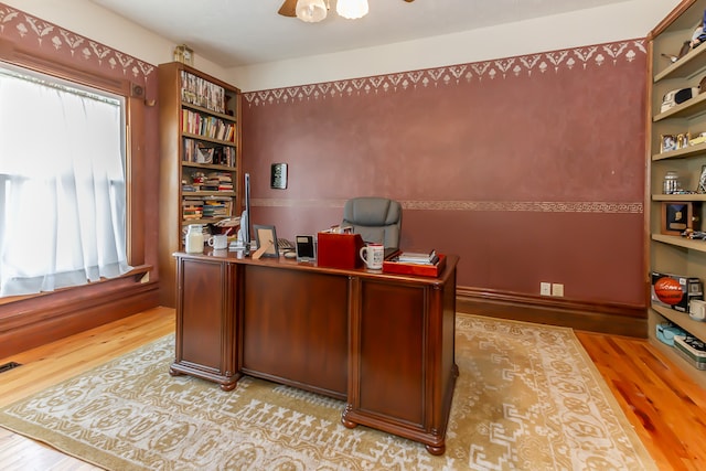 office space featuring light wood-type flooring and ceiling fan